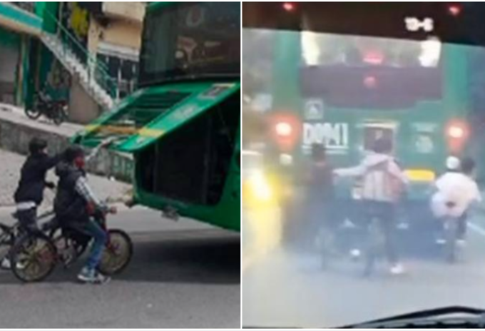 Ciclistas colgados de buses del SITP