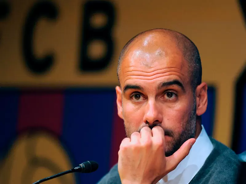 Pep Guardiola en sus épocas como técnico del FC Barcelona