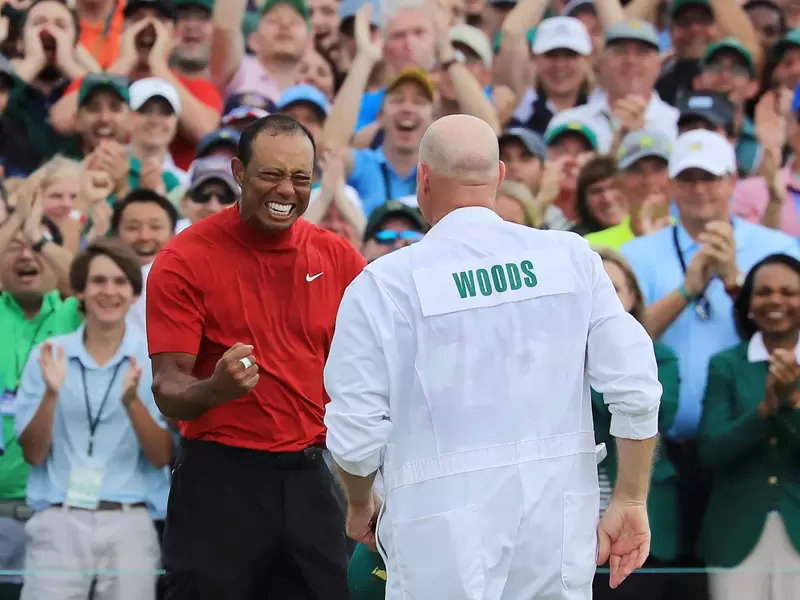 Tiger Woods y su caddie