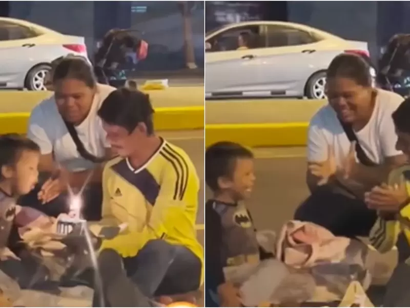 Padres celebran emocionados el cumpleaños de su hijo en la calle Padres celebran emocionados el cumpleaños de su hijo en la calle