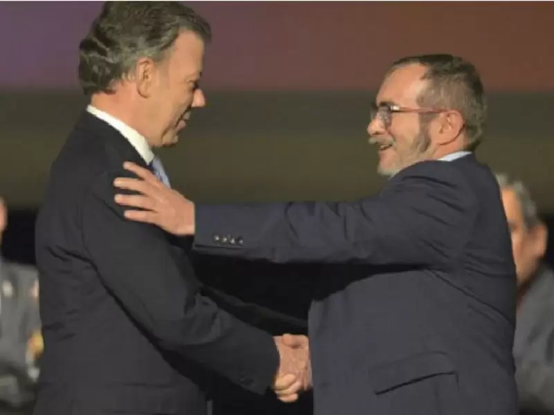 Presidente Juan Manuel Santos y 'Timochenko' Presidente Juan Manuel Santos y 'Timochenko'